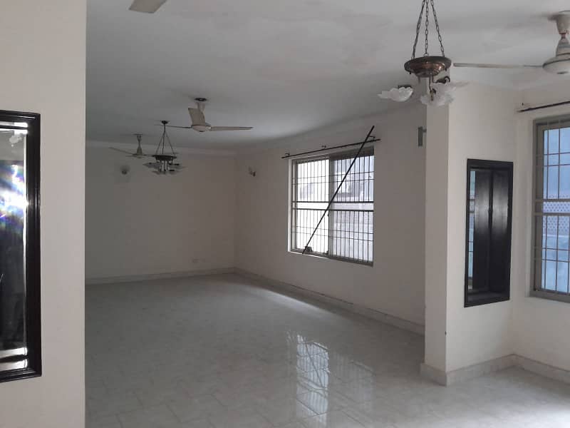 2 Kanal Double Unit House on Rent on Main Airport Road Phase 1 DHA Lahore . big lawn & Garden and parking 2