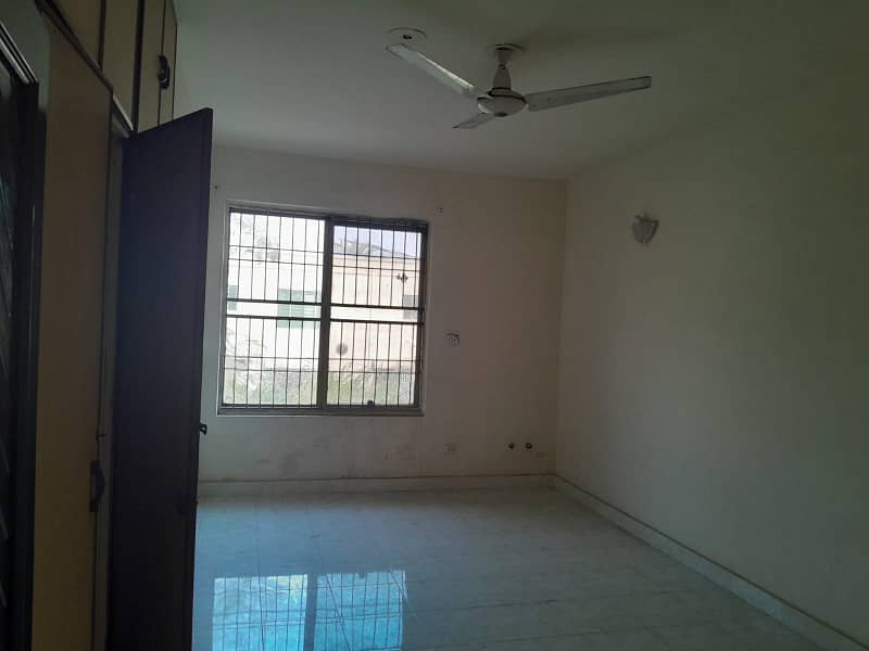 2 Kanal Double Unit House on Rent on Main Airport Road Phase 1 DHA Lahore . big lawn & Garden and parking 8