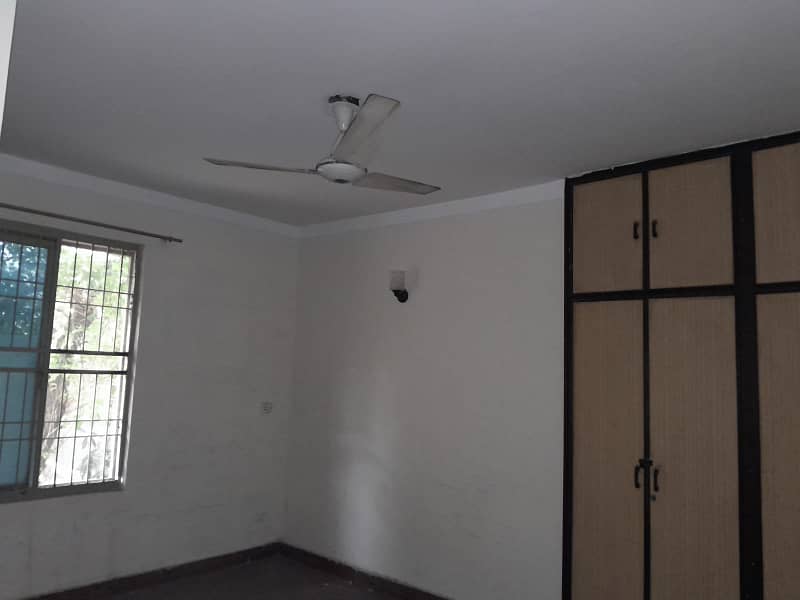 2 Kanal Double Unit House on Rent on Main Airport Road Phase 1 DHA Lahore . big lawn & Garden and parking 13