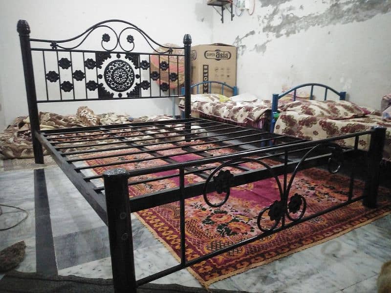 An iron double bed in good condition 1