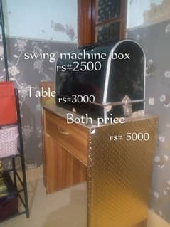 Sewing table with swing machine box