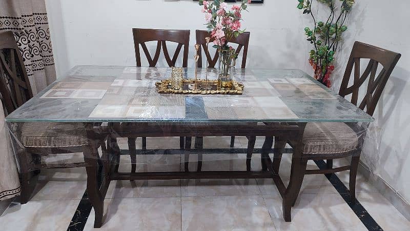 dinning table with 6 chairs - glass top 1