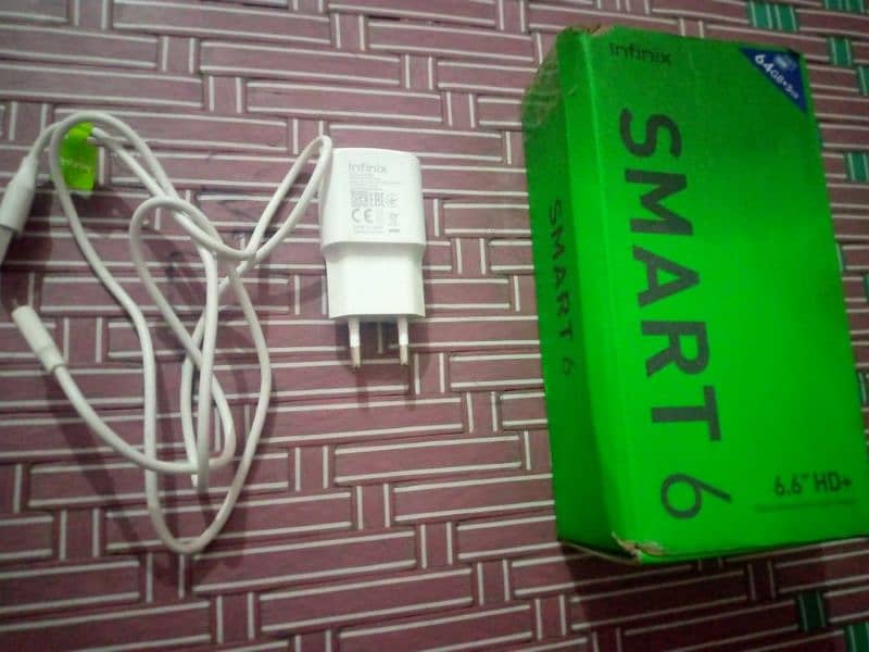 Infinix Smart six 3/64 condition 10/10 he daba charger 13