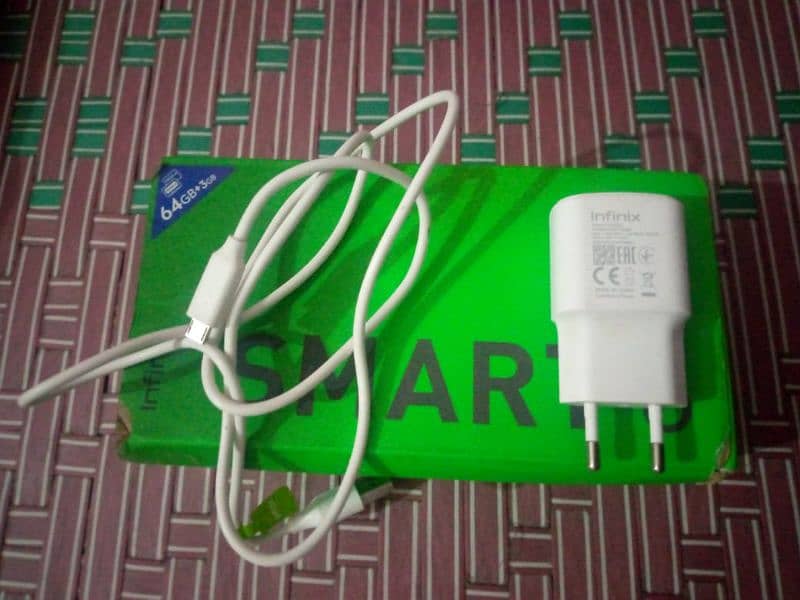 Infinix Smart six 3/64 condition 10/10 he daba charger 14