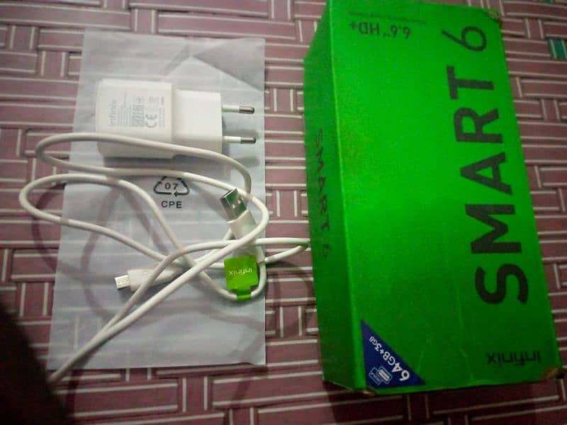 Infinix Smart six 3/64 condition 10/10 he daba charger 15