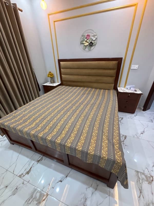 wood bed with 2 side tables and matress 2