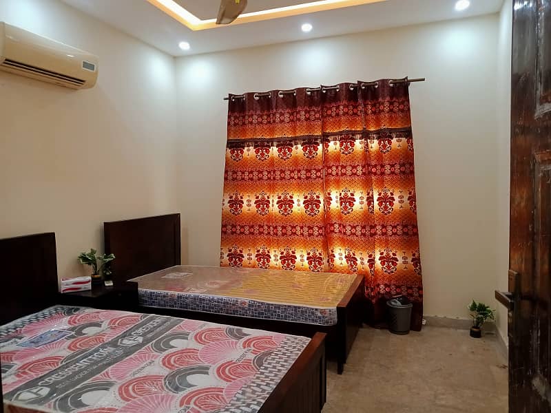 Furnish room per bed 21,000/- rent in alfalah town near lums dha lhr 7