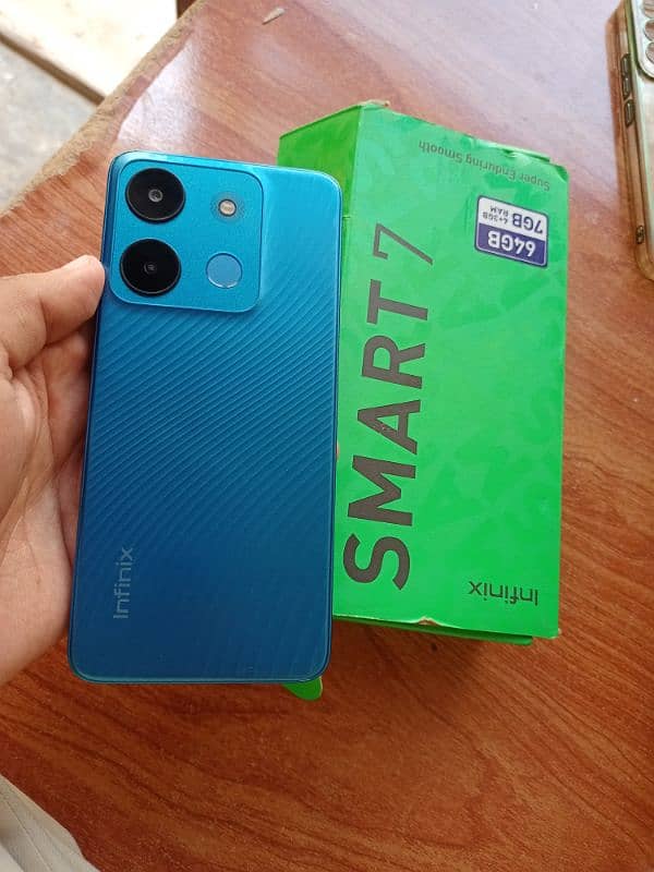 Infinix smart 7 4/64 with box and charger 1