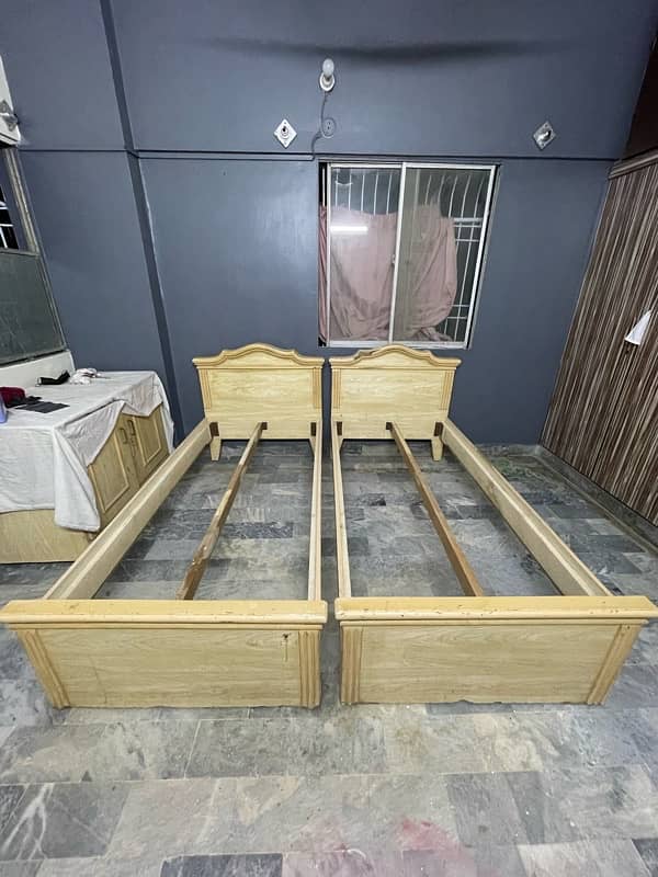 2 single bed with study table and large divider 1