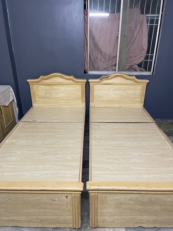 2 single bed with study table and large divider 2