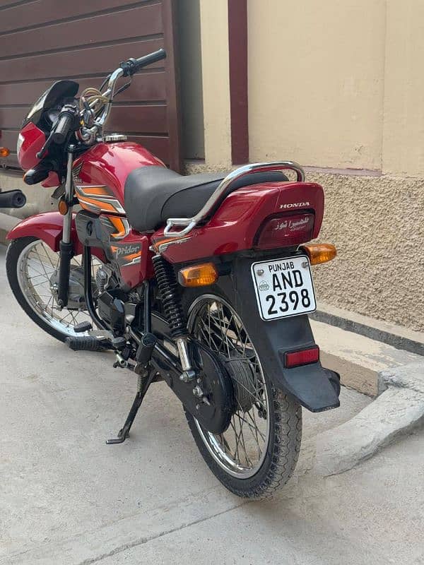 honda 100 Red punjab number 1