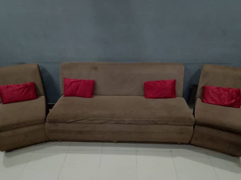 SOFA WITH SMALL RED CUSHIONS. 0