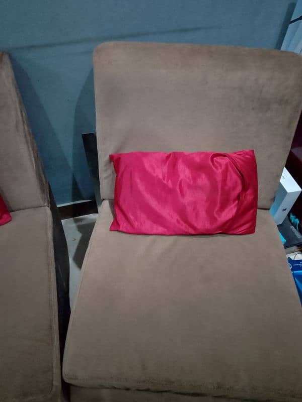 SOFA WITH SMALL RED CUSHIONS. 1