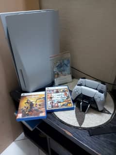 PlayStation 5, with 2 controllers, charging station, and 2 extra disc.