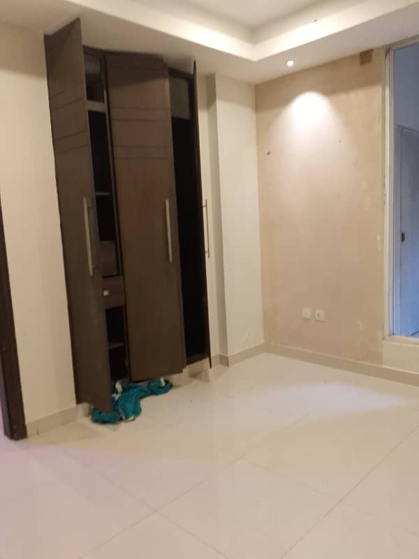 Beautiful apartment for rent in f11 exactive height beautiful tile floor 2 bedroom with attached bathroom TV lounge kitchen 2