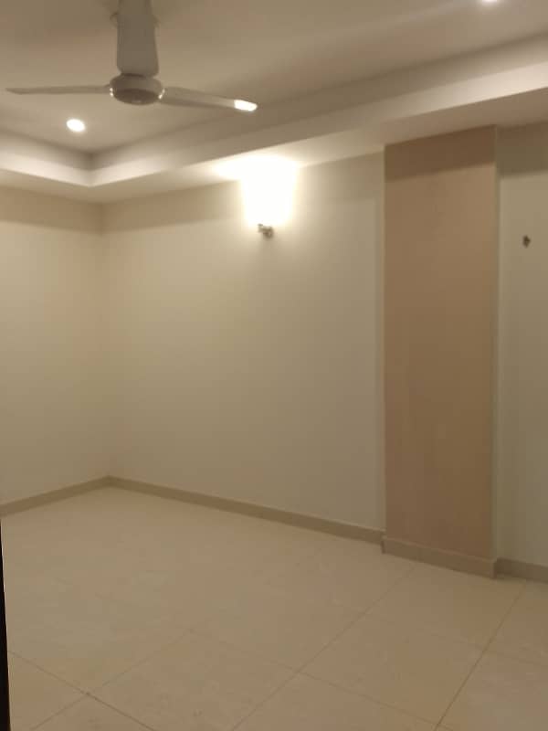 Beautiful apartment for rent in f11 exactive height beautiful tile floor 2 bedroom with attached bathroom TV lounge kitchen 5