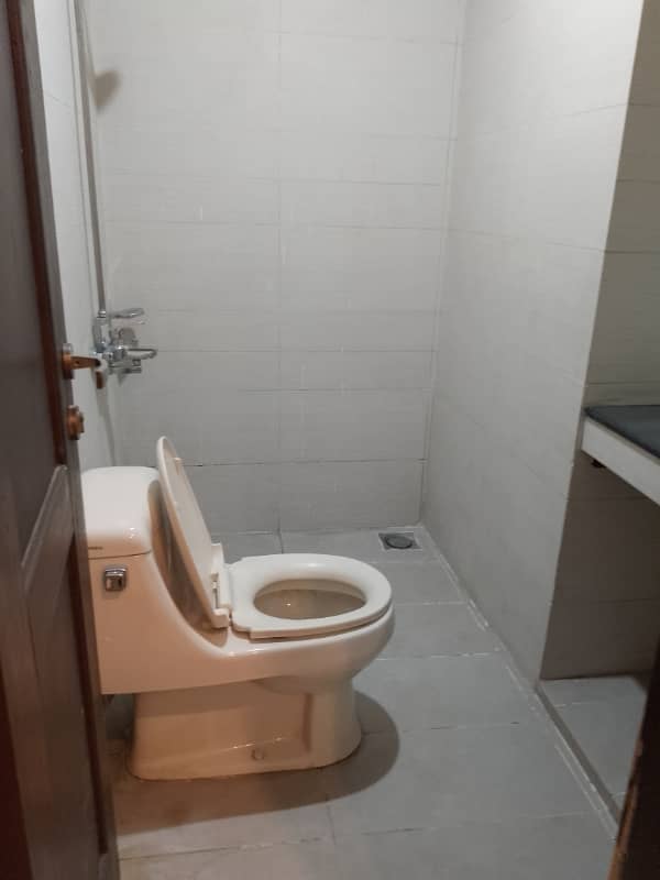 Beautiful apartment for rent in f11 exactive height beautiful tile floor 2 bedroom with attached bathroom TV lounge kitchen 6