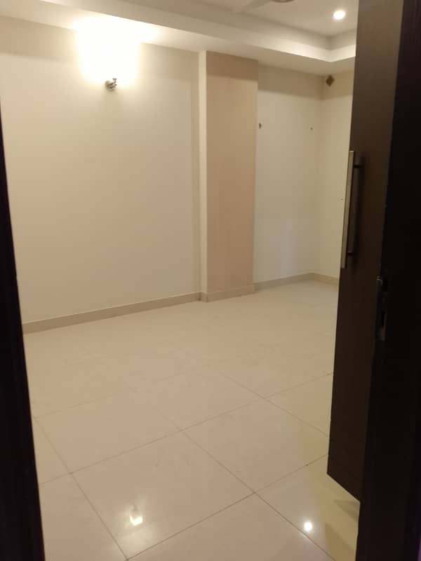 Beautiful apartment for rent in f11 exactive height beautiful tile floor 2 bedroom with attached bathroom TV lounge kitchen 9