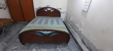 Queen size bed along with mattress.