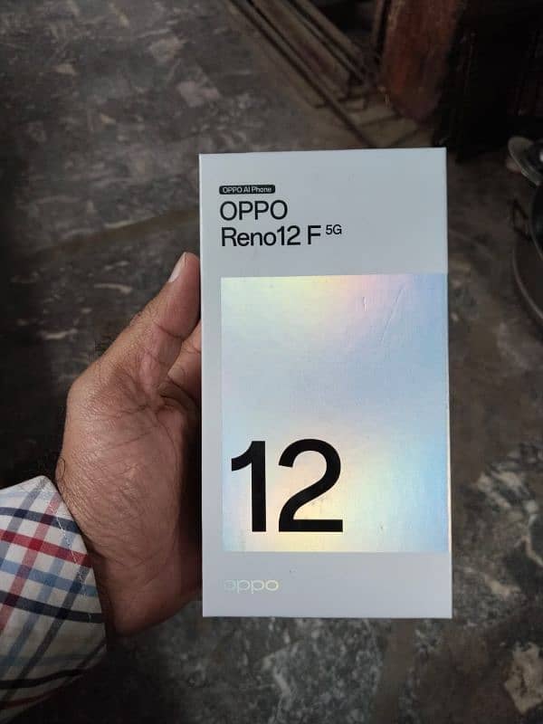 assalamualaikum am selling oppo Reno12f 5g 12.256 with box and charger 6