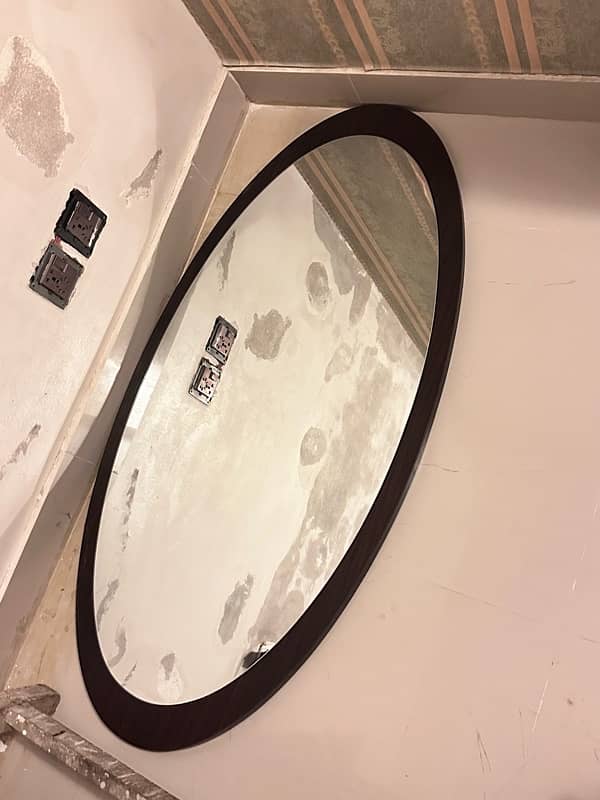 oval shaped long mirror. 1