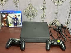 PS4 Slim 500gb FIFA19 edition with 2 original controllers and 2 games