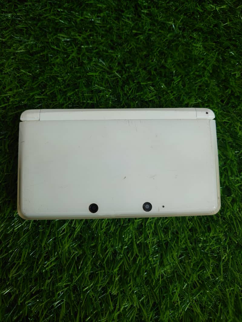 White Nintendo 3DS Modded with Games 64GB Card , Charging Cable . 2