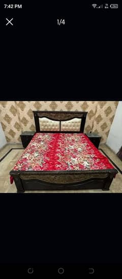 double bed with side table and mirror