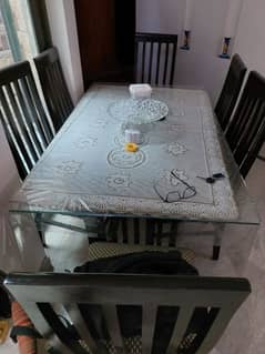 Wooden dining table and six chairs for sale