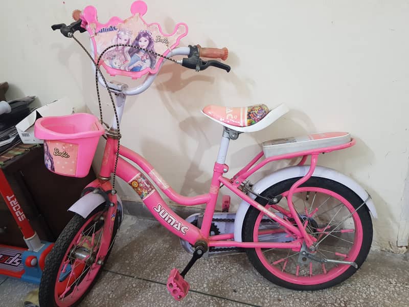 "18-inch Barbie bicycle with a front basket and a rear seat, ideal for 0