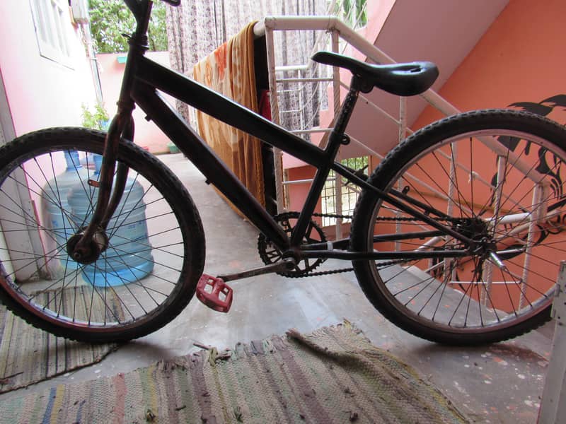 A USED BIICYCLE 26 SIZE 1