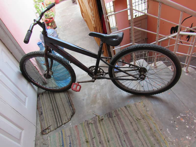 A USED BIICYCLE 26 SIZE 4