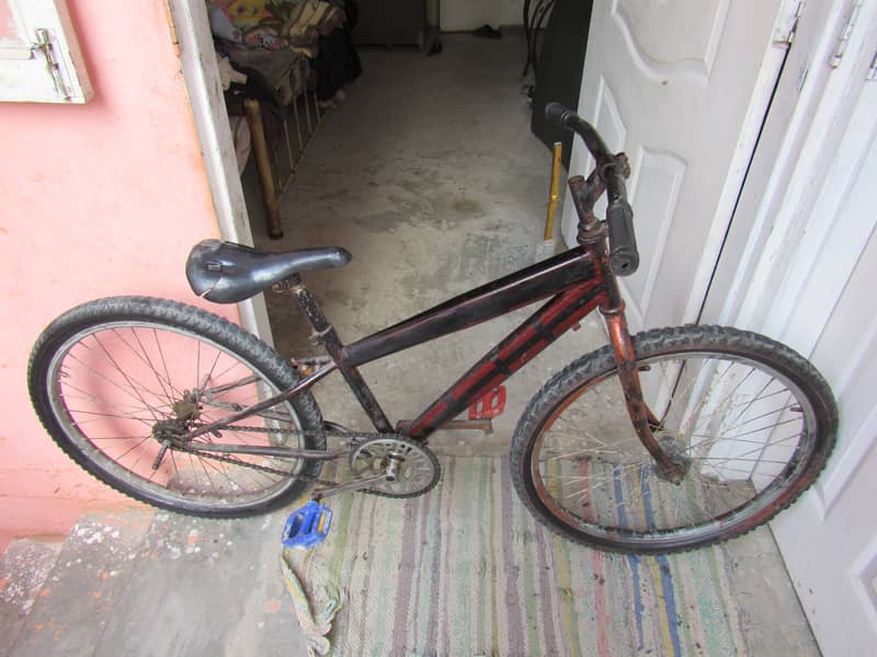 A USED BIICYCLE 26 SIZE 7