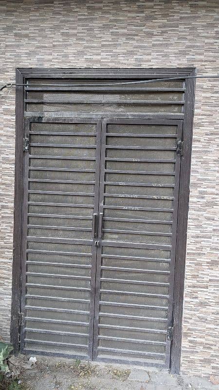 Diyar door with iron grill. 0