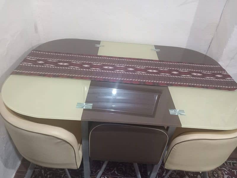 A very trendy dining table is available for sale. 2