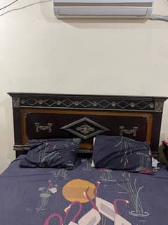 solid wooden bed with dressing and side tables