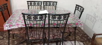 good condition 6 chairs iron rod and glass table