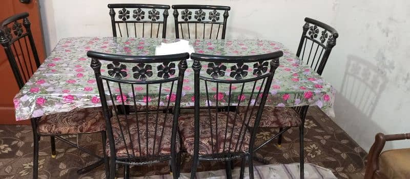 good condition 6 chairs iron rod and glass table 0