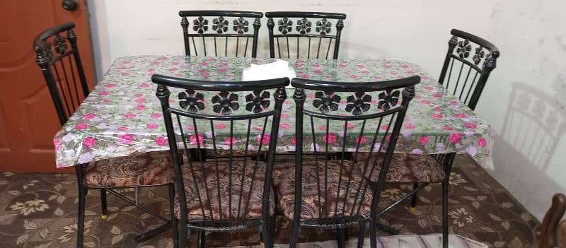 good condition 6 chairs iron rod and glass table 1