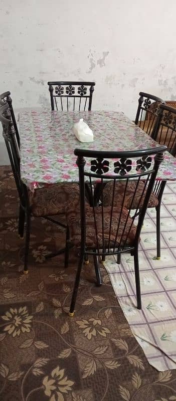 good condition 6 chairs iron rod and glass table 2