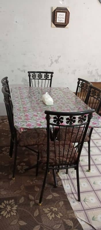 good condition 6 chairs iron rod and glass table 3