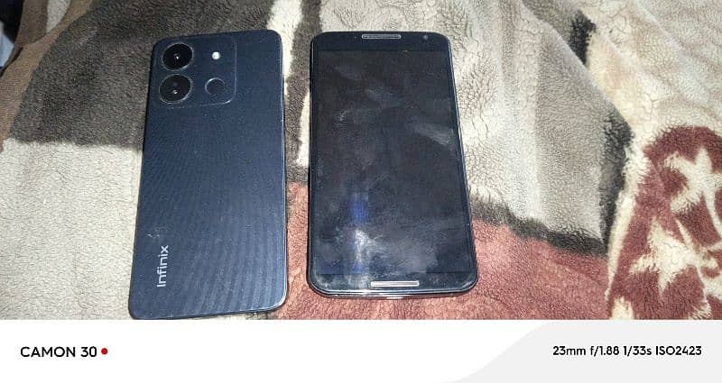 moto or infinix smart 7 2