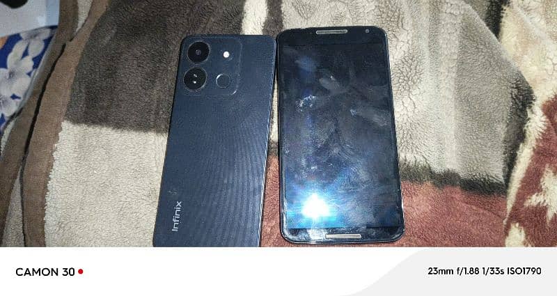 moto or infinix smart 7 4