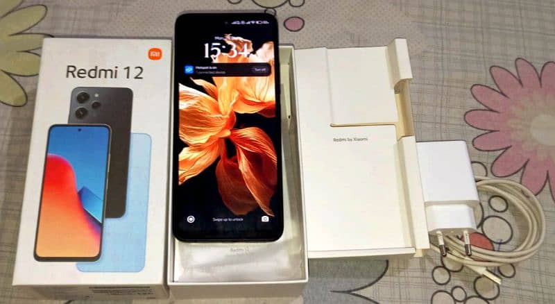 Redmi 12 10/10 condition with box and charger 0