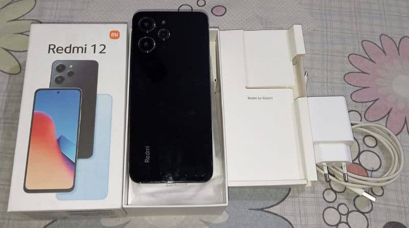 Redmi 12 10/10 condition with box and charger 1