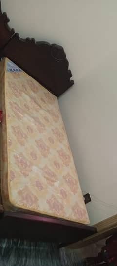 Wooden two single bed with mettres