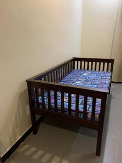 Solid wooden single bed is for sale