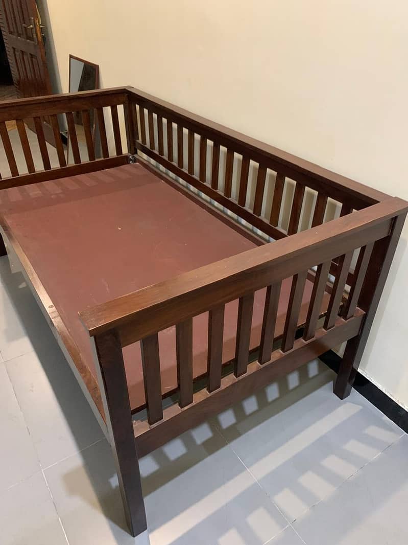 Solid wooden single bed is for sale 3