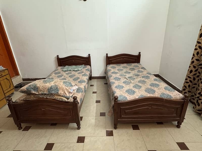 2 single wooden bed 1