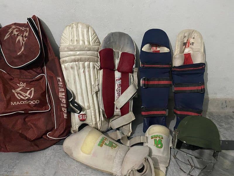 Good quality used English willow bats and helmts 6